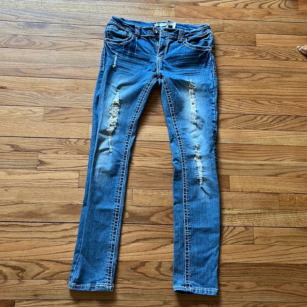 Women’s faded jeans. Has some stretch to it.